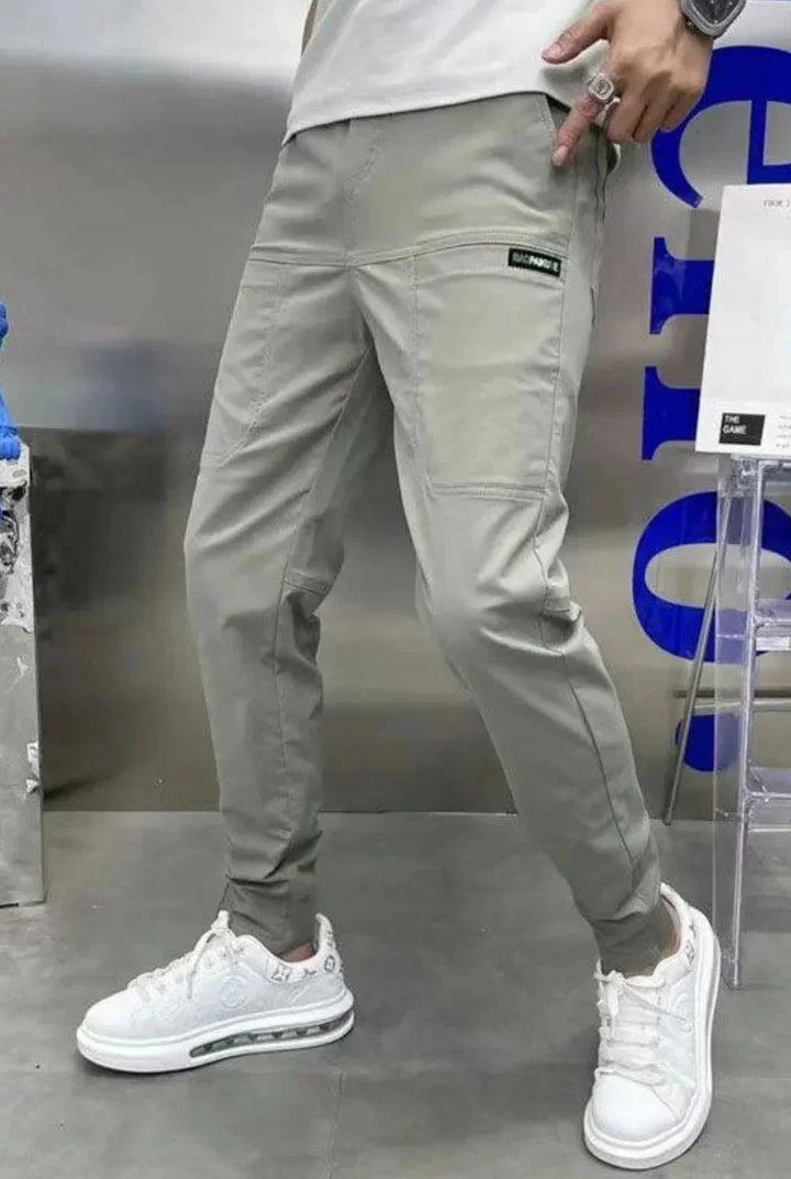 Men's comfortable utility cargo pants with an elastic waist, designed for everyday versatility & style.