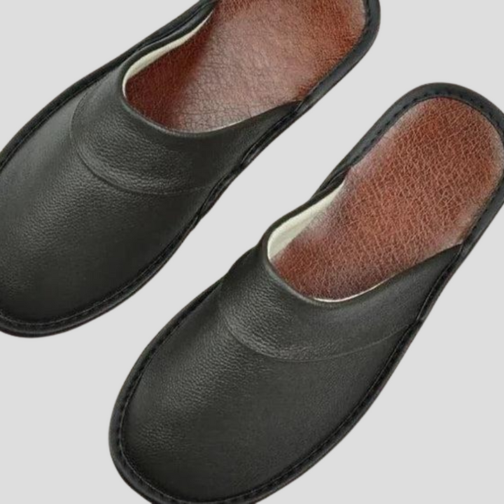 Soft, comfortable men's house slippers with easy slip-on design. Perfect cozy indoor footwear for home.