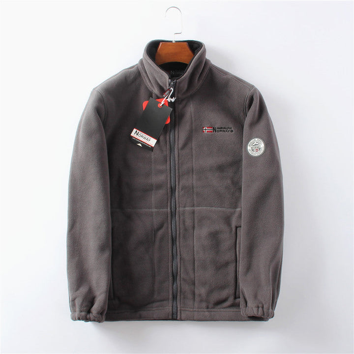 Front view of men's zip-up winter jacket in dark color. Ultimate warmth and comfort for cold outdoor wear.