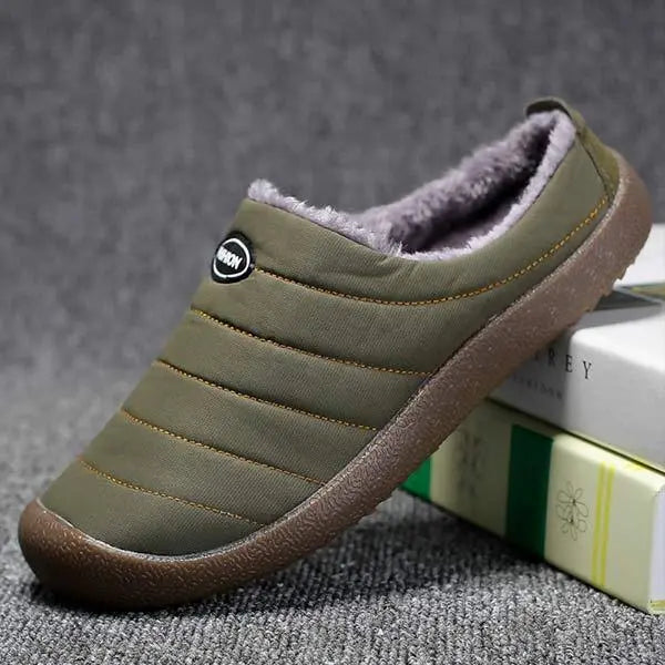 Comfortable men's house shoes, slip-on design, ideal for relaxing cozy home wear.