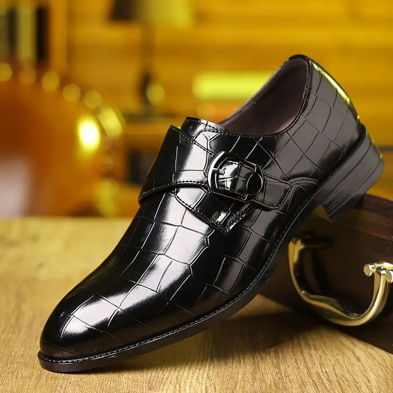 Men's crocodile-pattern slip-on loafers with stylish buckle and tapered toe for formal wear.