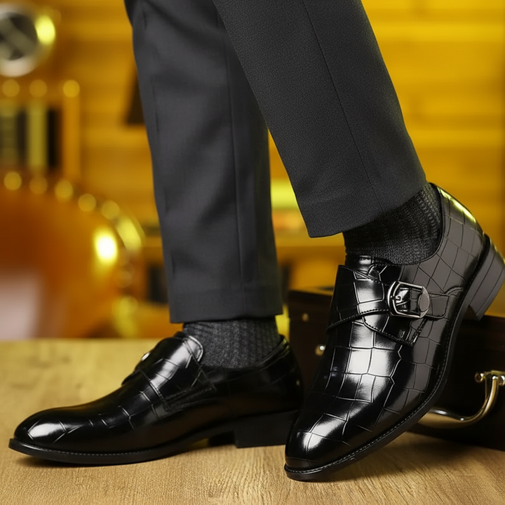 Stylish men's slip-on loafers featuring a detailed crocodile pattern, elegant buckle, and tapered toe.