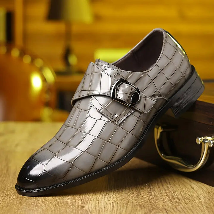 Elegant men's dress loafers with crocodile texture, slip-on design, and buckle for formal or stylish comfort.