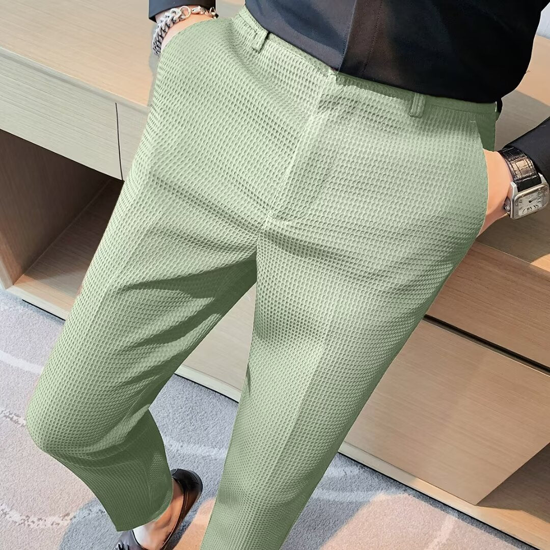 Men's cropped slim fit trousers in a modern smart casual style. Versatile chinos for contemporary menswear.