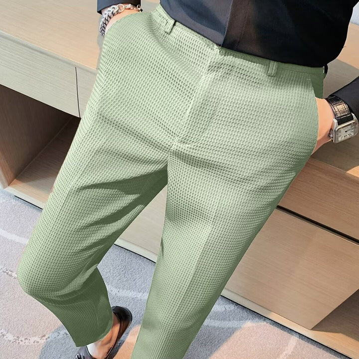 Men's cropped slim fit trousers in a modern smart casual style. Versatile chinos for contemporary menswear.