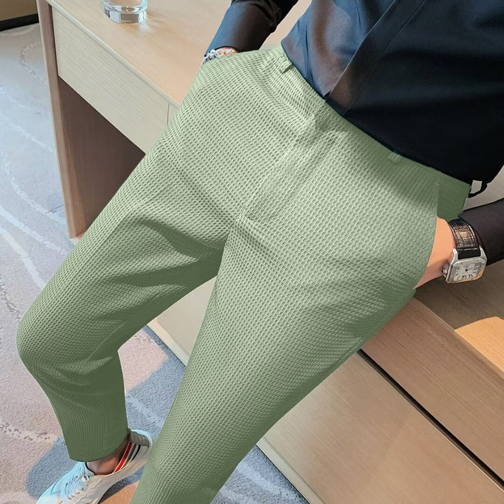 Modern men's slim fit cropped trousers, offering a versatile smart casual chino style. Perfect for various occasions.