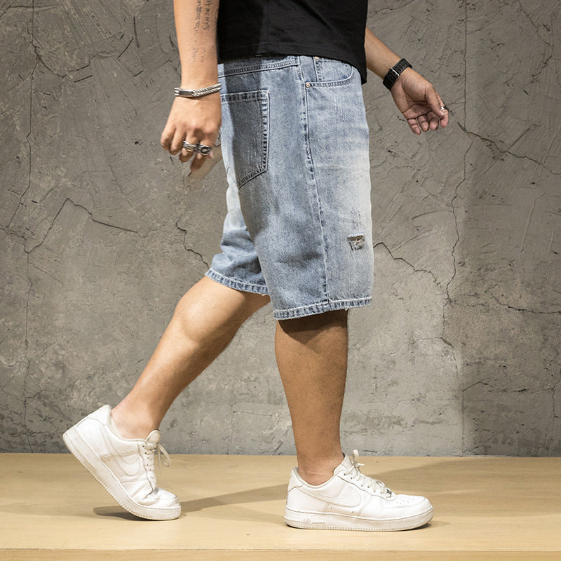 Relaxed fit men's light wash ripped shorts, ideal for comfortable casual wear and summer outfits.
