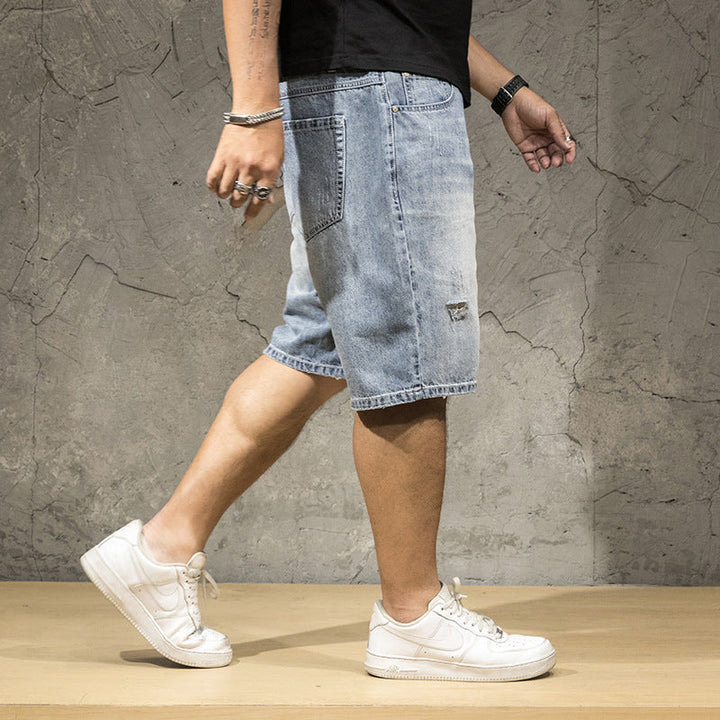 Relaxed fit men's light wash ripped shorts, ideal for comfortable casual wear and summer outfits.
