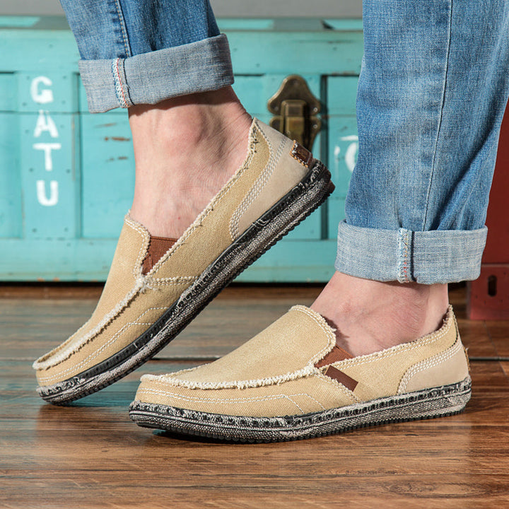 Men's distressed slip-on loafers, perfect for effortless casual style & everyday comfort.