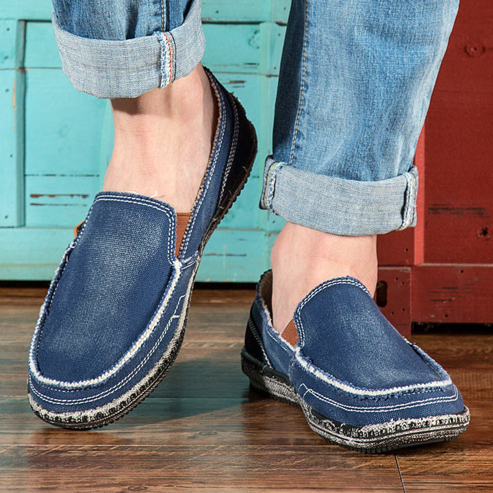 Stylish distressed men's slip-on loafers, excellent for spring/summer casual fashion & comfort.