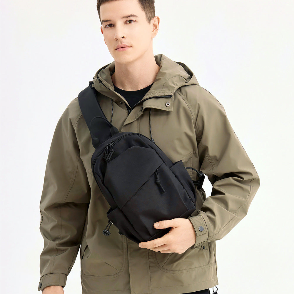 Adventure-ready men's black sling backpack. Durable urban travel bag & stylish everyday carry crossbody.