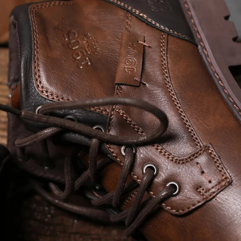 Rugged black men's ankle boots with secure lace-up design, perfect for durable work & casual style.