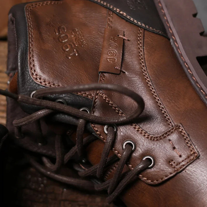 Rugged black men's ankle boots with secure lace-up design, perfect for durable work & casual style.