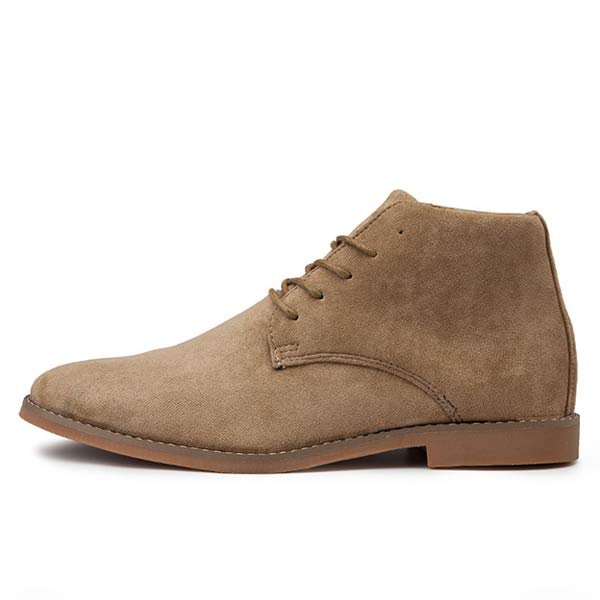 Close-up of men's durable brown leather ankle boots, showcasing texture, supportive design & cushioned interior.