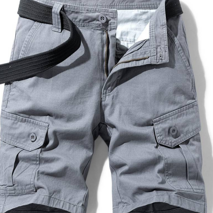 Man wearing durable cargo shorts, ideal for summer outdoor adventures, offering comfort and practicality.