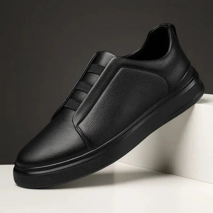 Sleek men's slip-on trainers with practical loop lacing, designed for ultimate comfort and modern casual footwear.