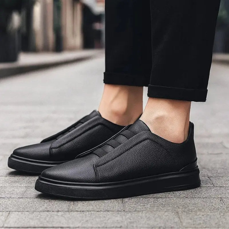 Effortless men's slip-on trainers featuring distinctive loop lacing, combining modern style with comfortable wear.