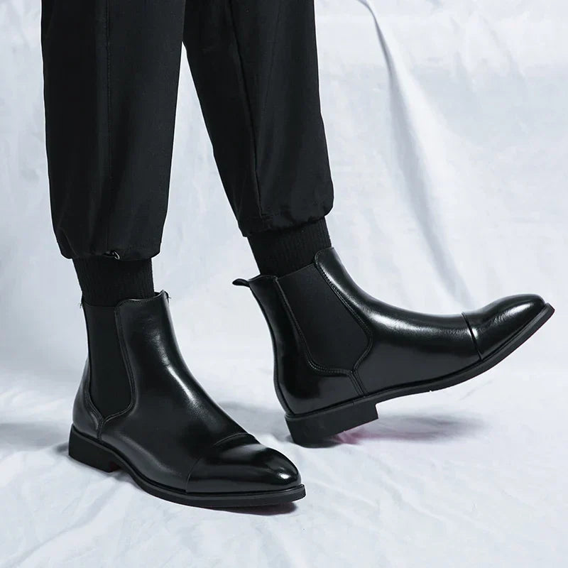 Polished men's slip-on leather boots for a refined, comfortable, and elegant footwear choice. Great for dress or casual.