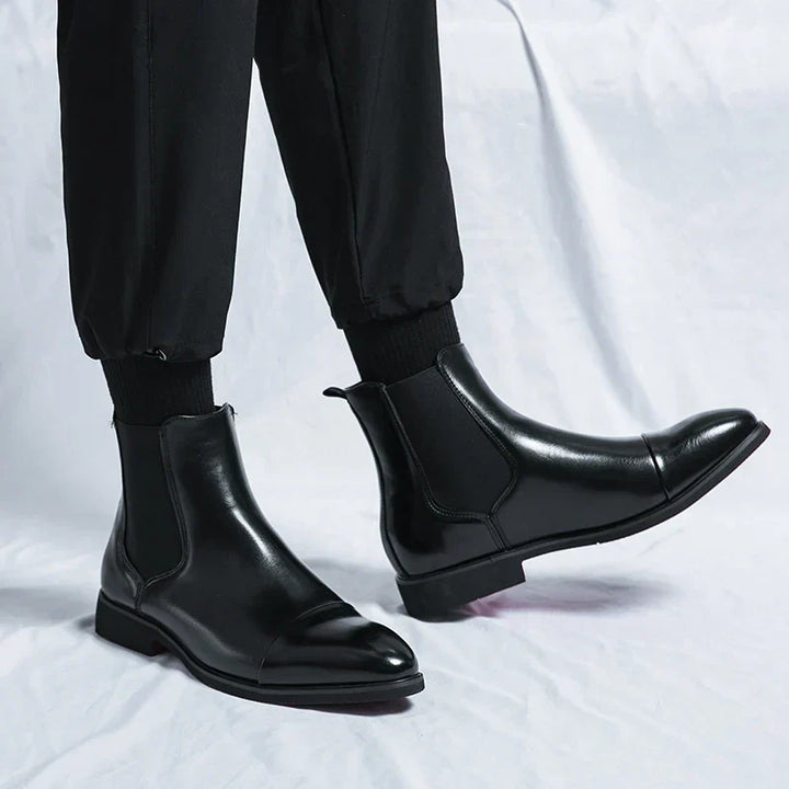 Polished men's slip-on leather boots for a refined, comfortable, and elegant footwear choice. Great for dress or casual.