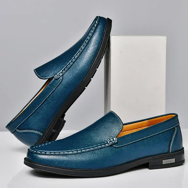 Man wearing comfortable men's black slip-on loafers, showcasing versatile and elegant style. Ideal for formal or casual wear.
