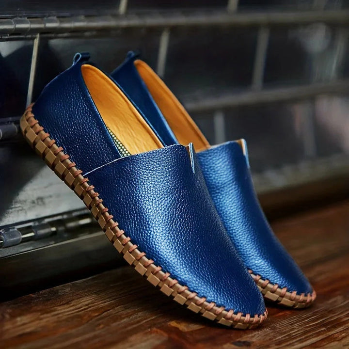Stylish black matte finish slip-on loafers for men, ideal for formal or casual wear.