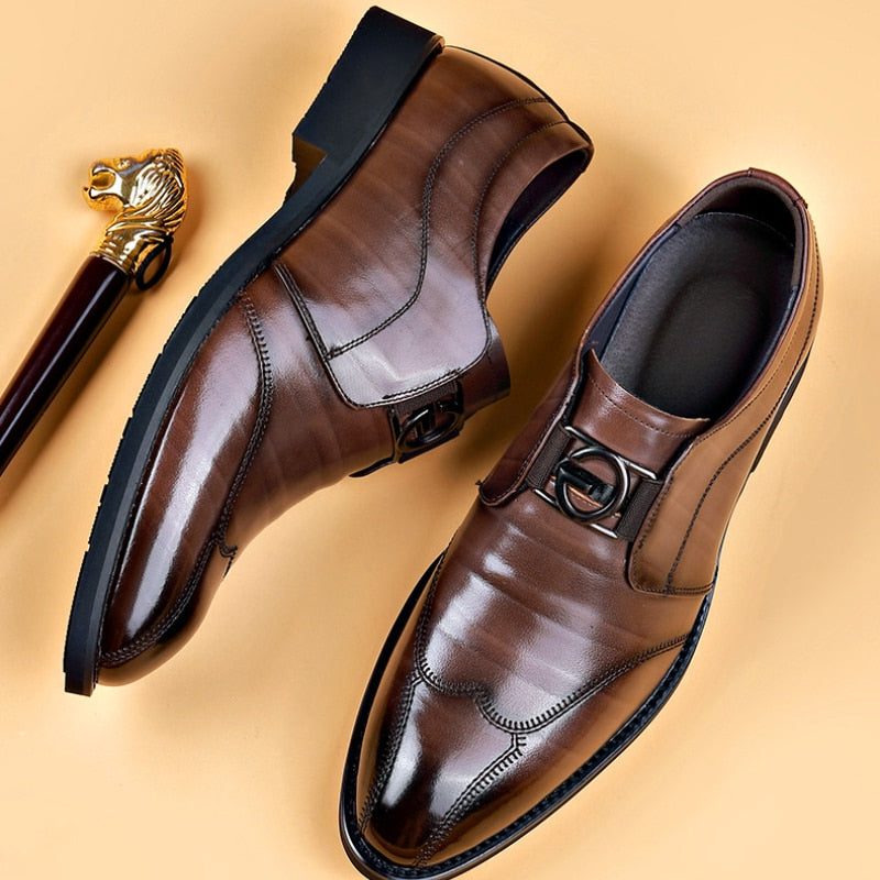 Stylish men's leather monk strap shoes with a pointed toe & buckle. Perfect slip-on formal footwear for business attire.