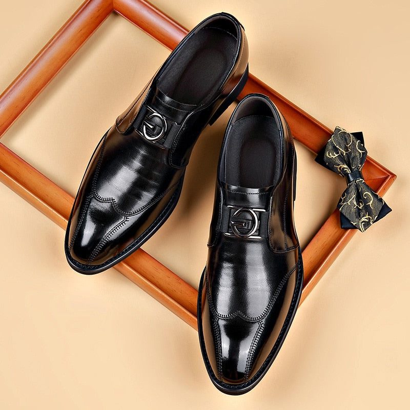 Modern men's pointed-toe monk strap shoes. Fashionable buckle closure & elegant design for formal or business wear.