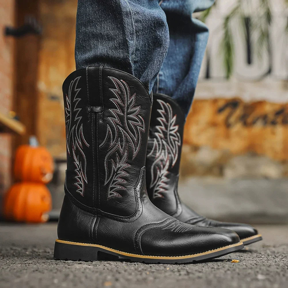 Close-up of intricate embroidery detail on men's brown mid-calf boots, ideal for versatile everyday wear.