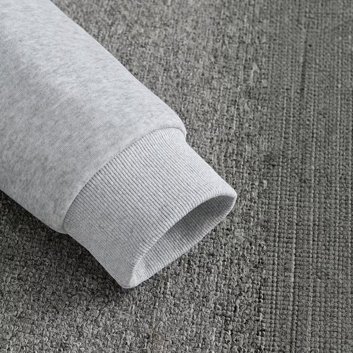 Close-up of comfortable fabric on men's everyday comfort hooded pullover sweatshirt.