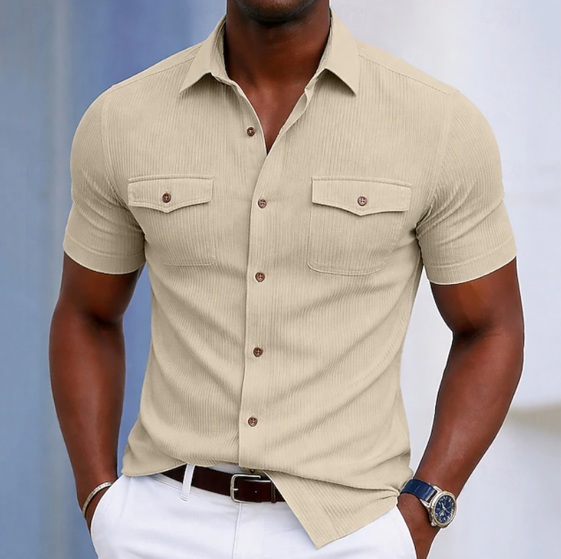 Versatile men's pocket button-up shirt for everyday wear. Comfortable design suitable for summer or casual fashion.