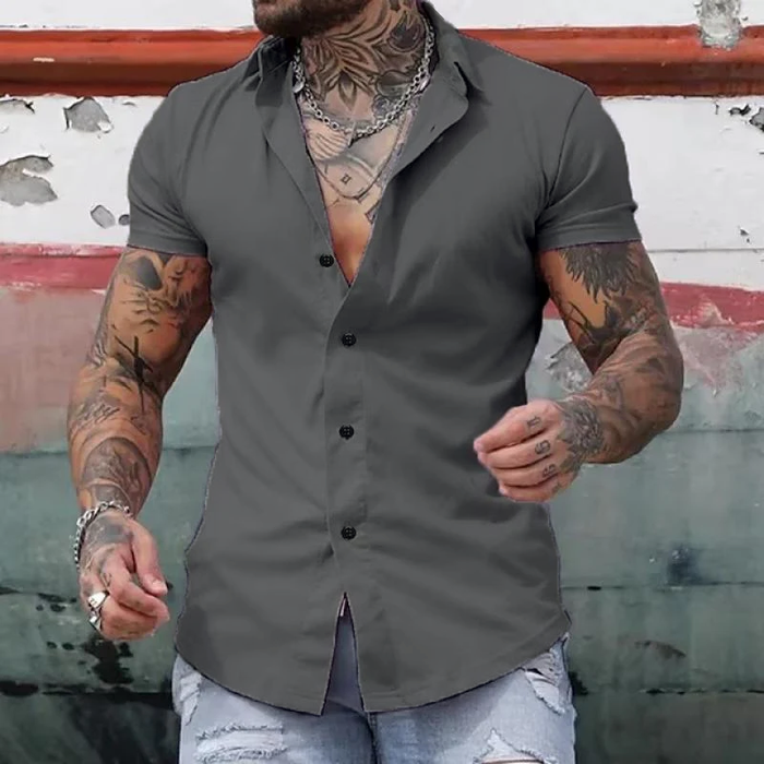 Man wearing a sleek fitted short sleeve shirt, showcasing its modern cut & casual elegance.