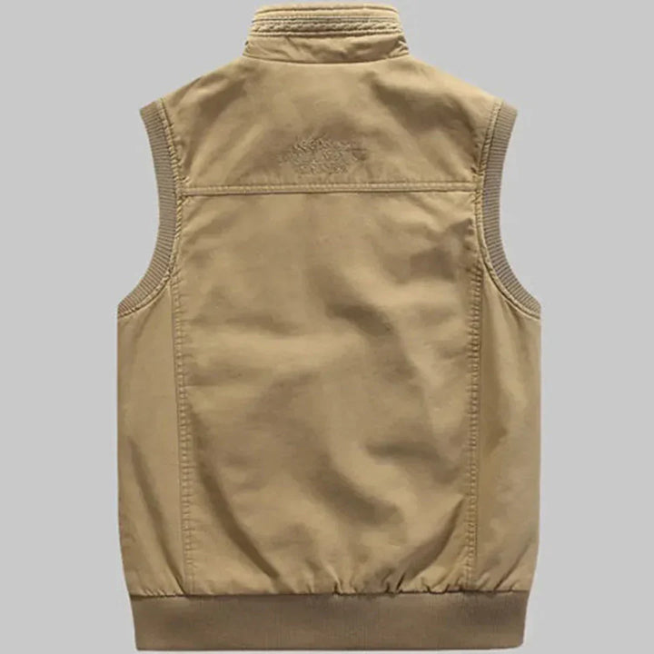Sleeveless cotton utility vest for men with many pockets, perfect for outdoor activities & casual wear.