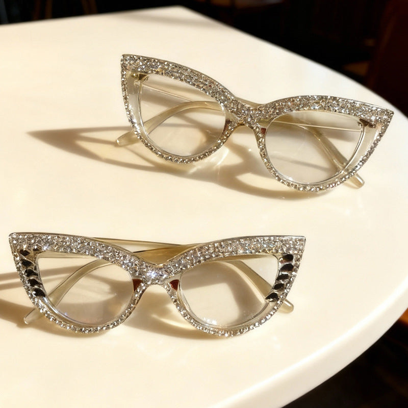 Close-up of men's rhinestone-studded cat-eye sunglasses, a glamorous fashion accessory.