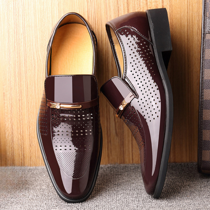Men's black glossy patent leather slip-on dress shoes, perfect for formal business events.