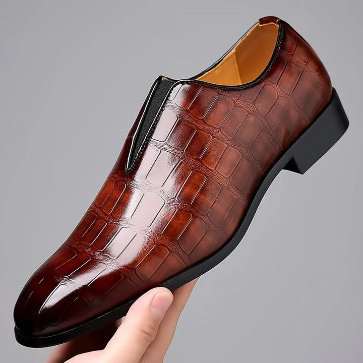 Men's glossy crocodile pattern slip-on brogue shoes, ideal for formal and dress wear.
