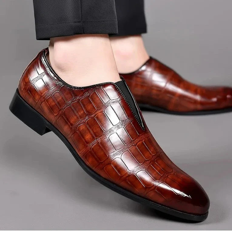 Luxurious men's glossy crocodile pattern slip-on dress shoes, featuring a unique texture.