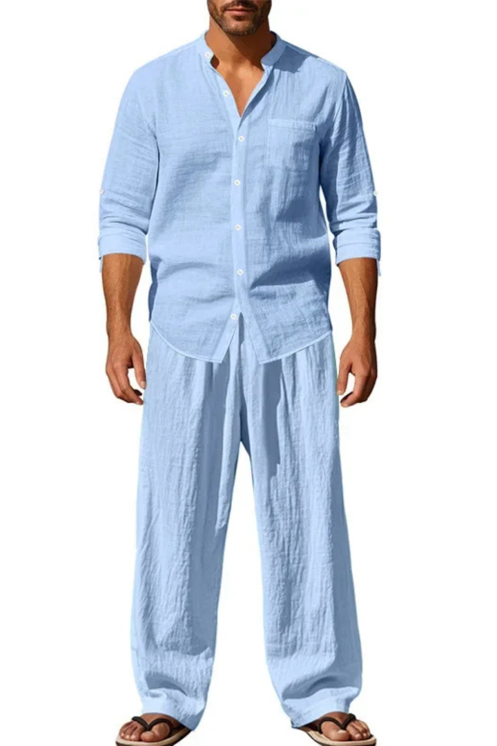 Elegant men's matching set with a grandad collar shirt and straight leg trousers, showcasing effortless style.