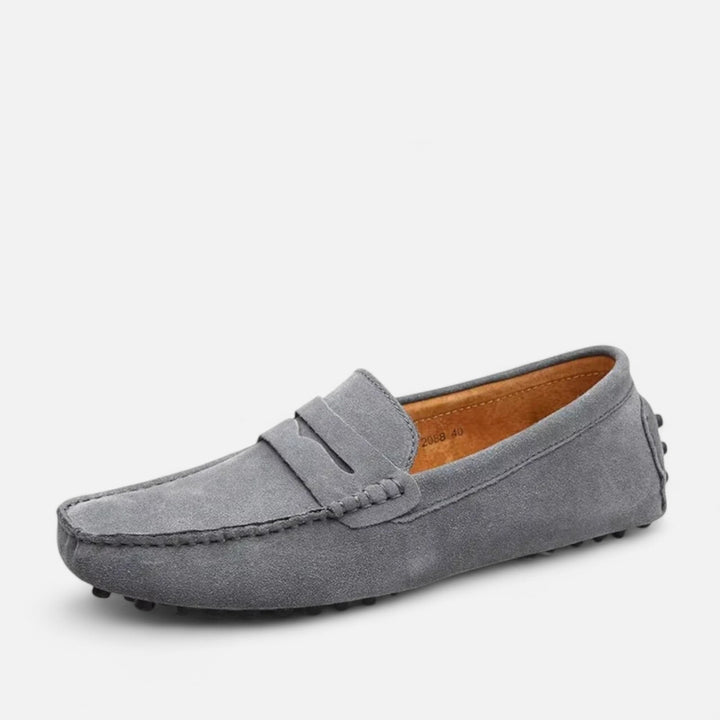 Assortment of classic men's handmade leather loafers, offering comfort and timeless smart casual style.