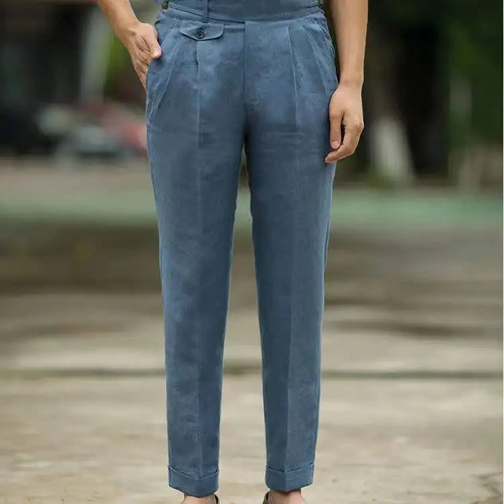 Man wearing versatile high waist tailored trousers, perfect for creating classic men's elegant fashion looks.
