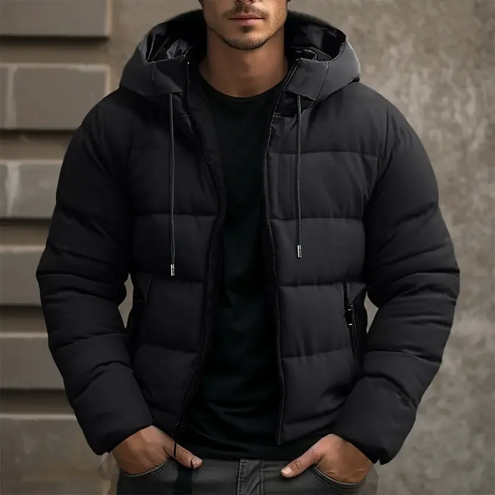 Zip-up men's hooded puffer jacket, offering warmth and modern winter style.