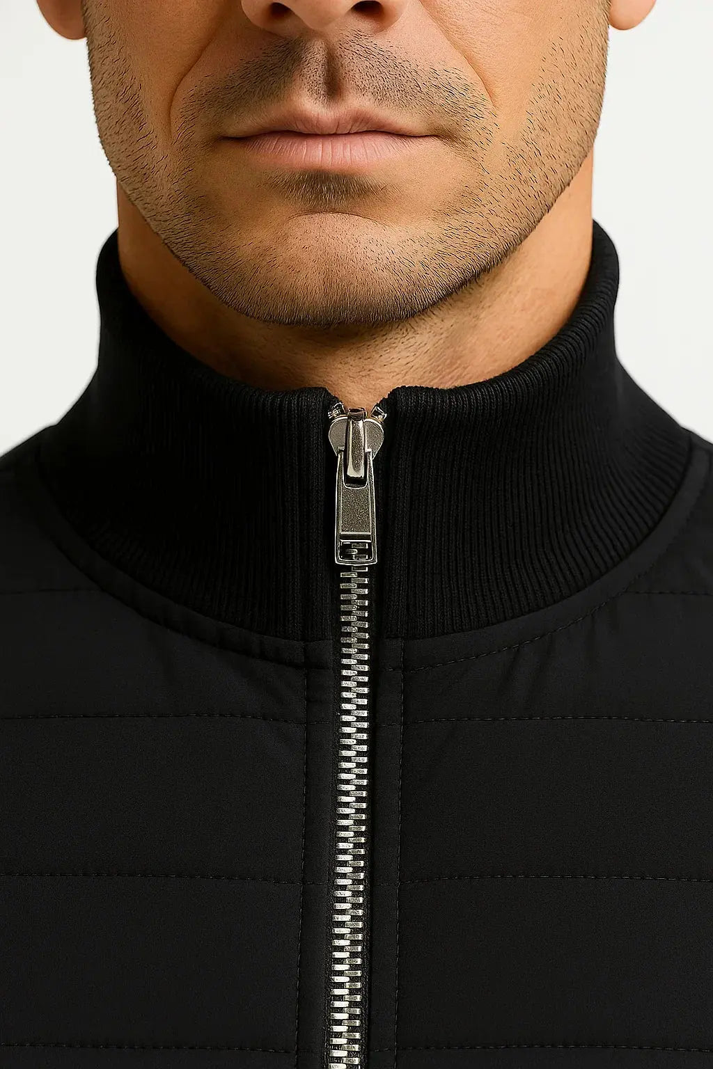 Stylish men's hybrid jacket featuring a quilted body and soft knitted sleeves. Perfect lightweight transitional wear.