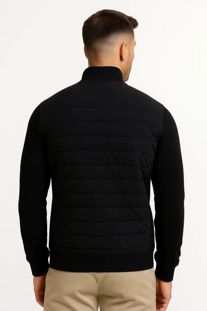 Lightweight men's hybrid jacket with a quilted torso and cozy knitted sleeves. A versatile fall/spring layering piece.