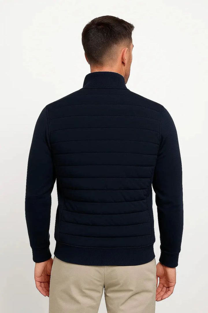 Smart casual men's hybrid quilted jacket with knitted sleeves. Modern design for a sleek, versatile outerwear look.