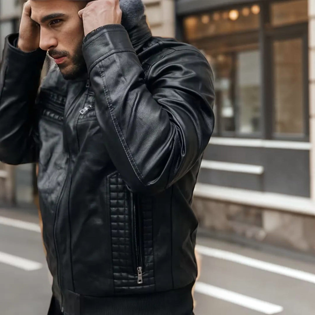 Black Isaac men's leather look bomber jacket with a hood, secure zip front, and classic ribbed cuffs. Fashionable.