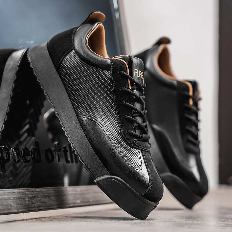 Front view of sleek men's black Italian style sneakers. Versatile smart casual shoes for fashion & comfort.