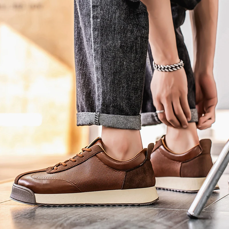 Detailed view of men's brown Italian style leather sneakers. Stylish, comfortable & versatile everyday footwear.