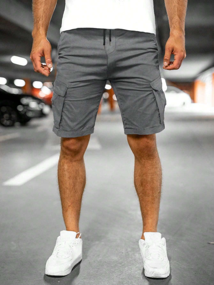 Man in relaxed men's cargo shorts, perfect for hiking, travel or casual summer outings, showing versatility & comfort.