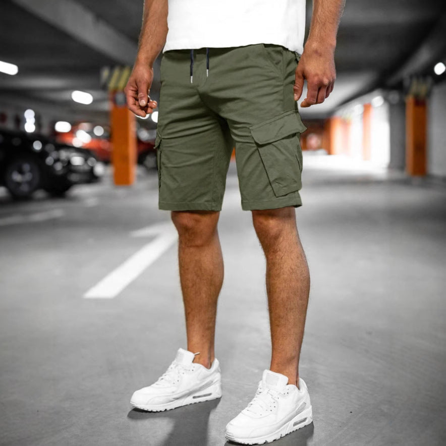 Man wearing casual men's cargo shorts, walking outdoors, highlighting comfort, utility & summer style.