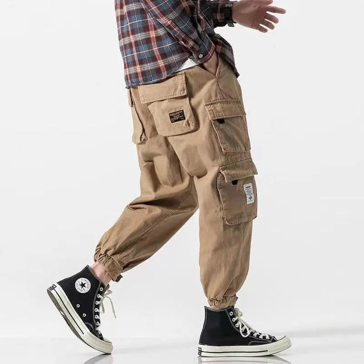 Men's khaki tapered cargo pants. Versatile & durable for streetwear, casual & everyday comfort.
