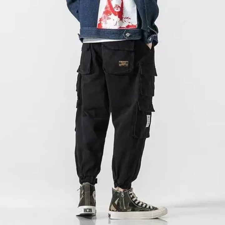 Black men's tapered trousers, durable & comfortable, ideal for casual men's fashion and everyday wear.